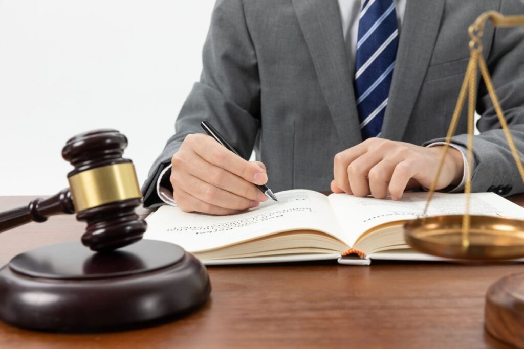 Business lawyer meeting with clients to discuss legal documents in an office
