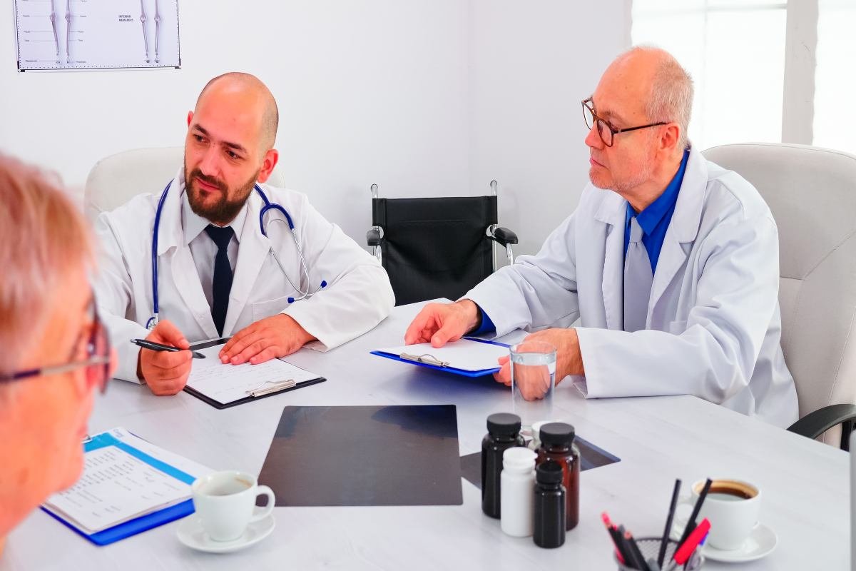 Medical malpractice attorney consulting with a client in a law office